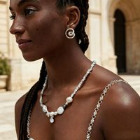 Boucles d'oreilles minimalistes en spirale creuse Gaovo, créoles en acier inoxydable plaqué or 18 carats pour la vente transfrontalière européenne et américaine.