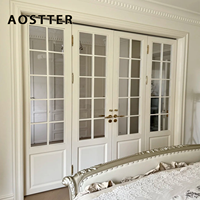 Porte pliante en aluminium AOSTTER de style grille avec panneau de sécurité transparent et amortisseur à fermeture douce pour architecture classique