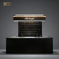 Comptoir de réception commercial sur mesure en acier inoxydable avec vitrine et compartiment de rangement métallique pour aménagement de bars, salons et clubs