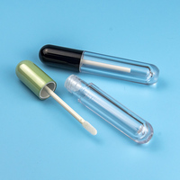 Récipient à rouge à lèvres en plastique transparent de luxe OEM Tube de balle de brillant à lèvres vide avec logo personnalisé avec sérigraphie Étiquetage cosmétique