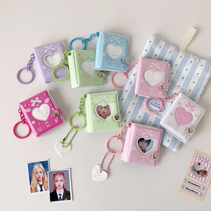 Álbum de fotos con cubierta de PVC de 2 pulgadas con diseño de nudo de mariposa y corazón hueco, colgante de llavero boutique, álbum de almacenamiento de pegatinas para estudiantes y mujeres - Product Image 1