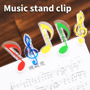 Clips transparents en cristal coloré en forme de note de musique, parfaits pour maintenir les partitions de piano, les livres et les papiers. - Product Image 1