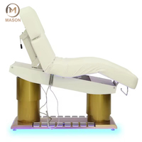 Nouveau lit de luxe pour salon spa et clinique 4 moteurs Table de massage électrique inclinable en cuir beige avec lumière LED pour salon Base dorée