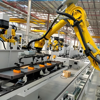 Robot palettiseur collaboratif automatique à 6 axes contrôlé par PLC avec bras de palettisation sous vide et effector final personnalisé pour matériaux