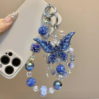 Breloque de téléphone papillon bleu foncé avec gros strass et perles, lanière de poignet pour sac, bijou artisanal lourd, cadeau pour femme