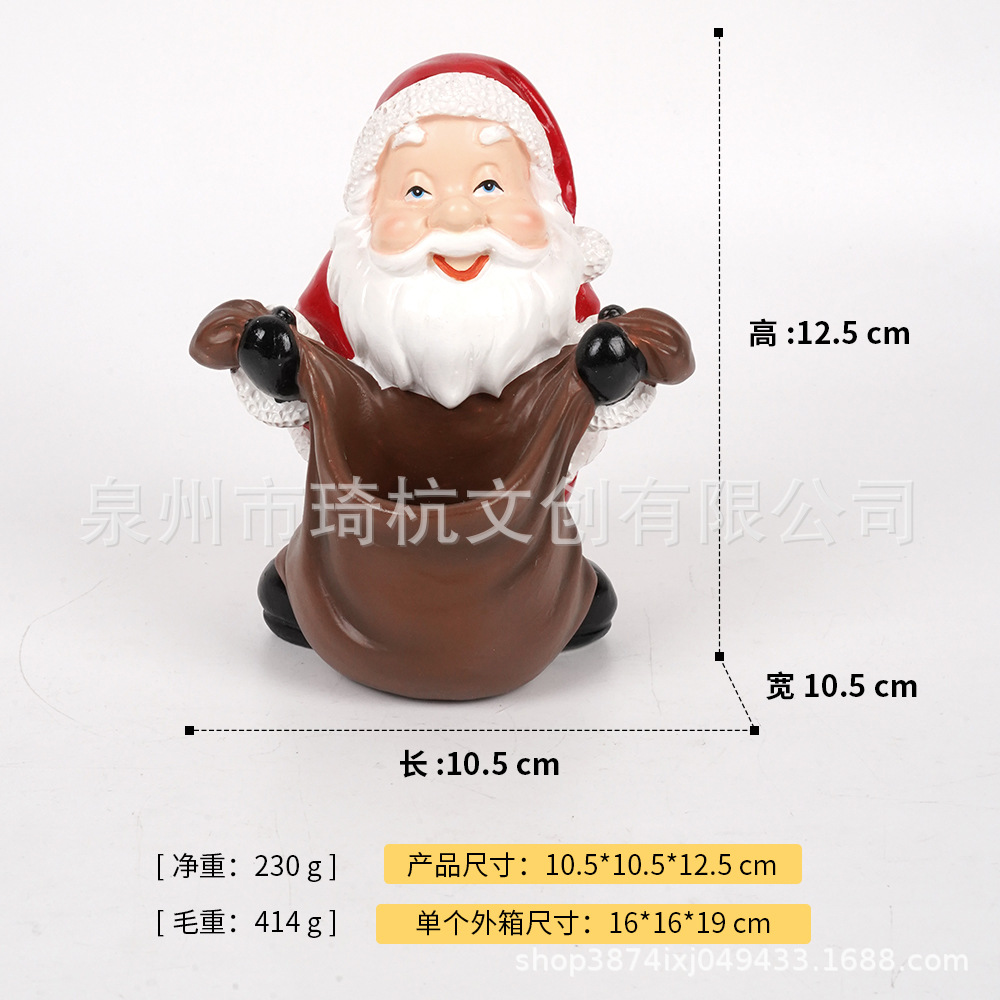 Père Noël portant un sac à deux mains