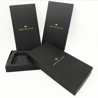 Boîte cadeau pour montre en papier rigide noir magnétique avec insert en mousse, pelliculage mat et gaufrage, papier couché
