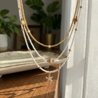 Collar RINHOO Boho Multicapa con Estrellas de Mar, Conchas y Cuentas de Arroz, Collar Vintage para Mujer con Imitación de Perlas, Gargantilla Apilada, Joyería para Fiesta en la Playa