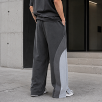 Pantalon de survêtement en molleton français à blocs de couleur personnalisés, coupe large avec ourlet fendu, pour hommes, marque privée pour tenues streetwear