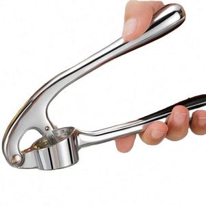 Easy to Squeeze Handle Kitchen Premium Garlic Press with Silicone Garlic Peeler and Cleaning Brush - Product Image 1