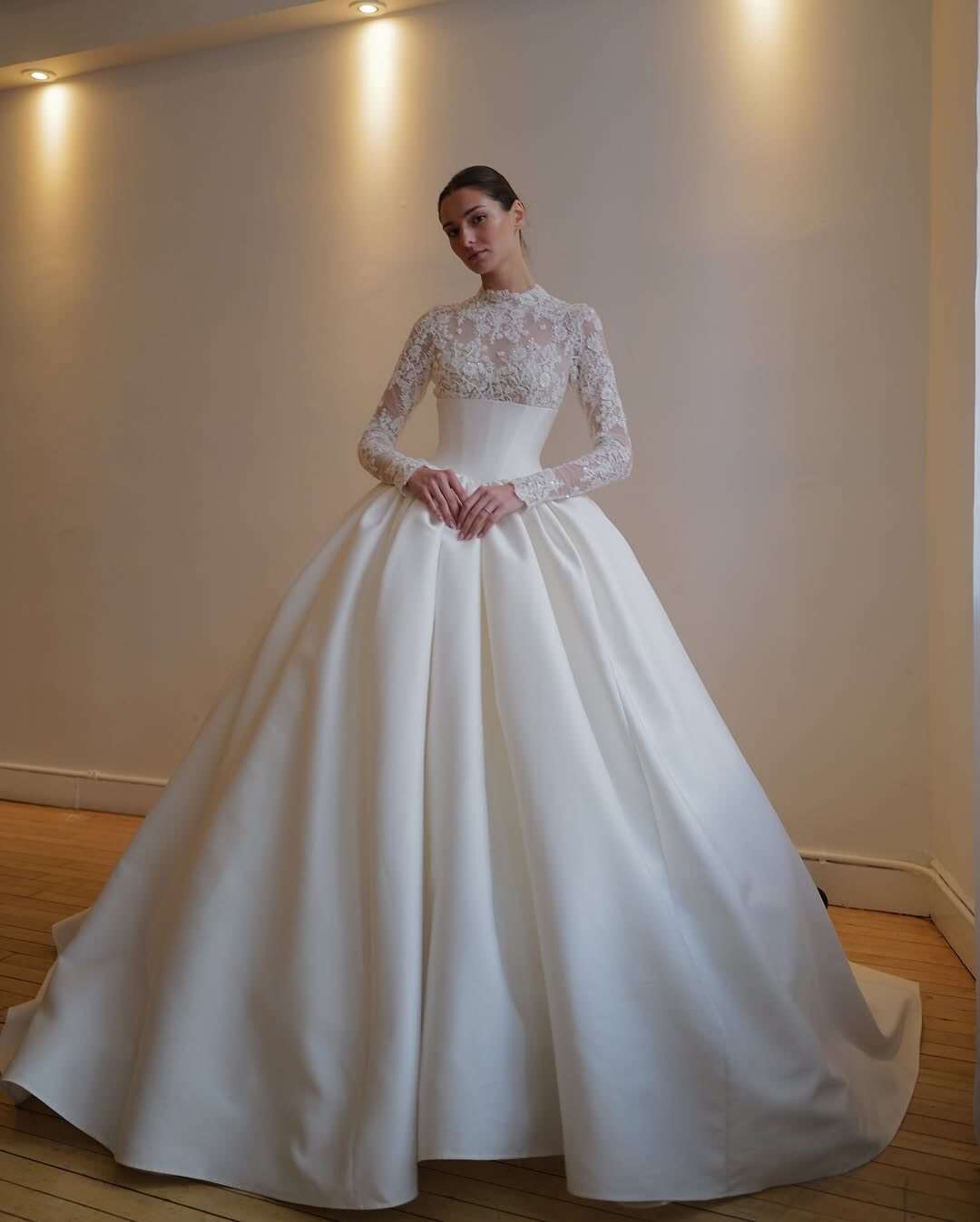 high neck basque waist wedding dress Fit and flare lace wedding dress with basque waist and long sleeves