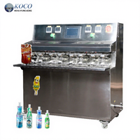 Machine de remplissage de boissons semi-automatique en acier inoxydable KOCO avec moteur pour l'emballage en sachet et en poche, haute vitesse 2000 BPH