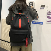 Sac à dos décontracté imperméable en tissu Oxford pour femmes et hommes, simple, couleur unie, avec sangle à lettres, léger, pour voyage, école, sac à dos de couple