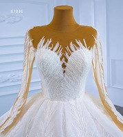 Robe de mariée de luxe Feishiluo à col rond, style moderne, coupe princesse, manches longues, ornée de perles, de paillettes et d'appliques brodées en dentelle