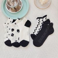 Vente chaude femmes été cheville chaussettes noir blanc Floral Design respirant mince utilisation quotidienne Logo corps manchette bas tricoté