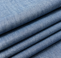 Tissu denim tissé à effet flammé pour vêtements féminins, chemises, jupes et pantalons en coton uni