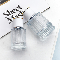 Flacons de parfum circulaires en verre transparent 50 ml rechargeables avec impression sérigraphique et pulvérisateur à pompe Marque HB Boîte en carton Vente en gros