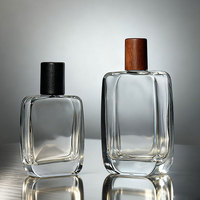 Vente en gros 50ml 100 ml vide de luxe plat personnalisé en bois noir couvercle vaporisateur cristal bouteille de parfum en verre 100 ml avec emballage
