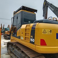 En stock : Excavatrice Komatsu PC160 d'occasion, haute performance pour travaux de rénovation de chantier