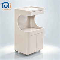 Chariot de rangement mobile incurvé brillant pour salon de beauté avec tiroir et armoire pour spa des ongles, salon de coiffure et de beauté