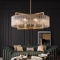 Luminaire de luxe pour salon Lustre moderne simple élégant postmoderne de créateur pour salle à manger Lustre en verre et cuivre