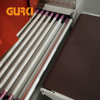 Machine d'emballage sous film rétractable GURKI à scellage continu - Automatique, électrique, haute température, pour aliments, boissons, produits chimiques, textiles