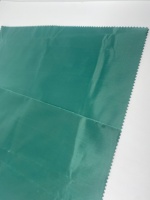 Tissu en taffetas 210T avec revêtement PU menthe, teinture unie, 100% polyester, avec traitement hydrofuge 12000 mm pour poncho/imperméable