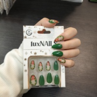 24 faux ongles à presser, style Noël, base verte, ruban rouge, forme amande moyenne, en ABS réutilisable, ambiance festive