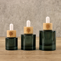 Flacons compte-gouttes ronds en bambou personnalisés pour soins de la peau 15ml 30ml 50ml 1oz Bouteilles de sérum en verre pour soins du visage pour les soins de la peau et les gouttes pour les yeux