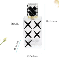 Flacon de parfum rectangulaire transparent de 100 ml avec bouchon découpé à motif noir et col doré, conteneur de parfum vide rechargeable