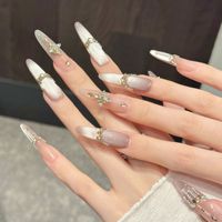 Faux ongles à presser pour femmes, blanc nacré, longs et carrés, avec paillettes, étoiles, chaînes et breloques en cristal, style luxe doré céleste, vente en gros