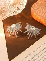 Boucles d'oreilles romantiques en gros Rolling Stone, nouveau modèle Ailes, entièrement serties de diamants, étoile scintillante, en alliage, matériau principal Guangdong Chine, unisexe