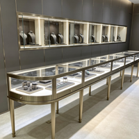 Présentoir de bijoux en or et diamant moderne de luxe Table ronde en acier inoxydable pour vitrine avec lumière LED