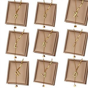 Gargantilla con Inicial y Borla XL220: Collar de Letra en Acero Inoxidable para Mujer, Pieza Viral para Superponer con 26 Opciones del Alfabeto - Product Image 1