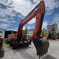 Excavatrice sur pneus d'occasion Doosan DX210, 21 tonnes, mobile, autopropulsée pour travaux d'ingénierie urbaine et de construction de pipelines