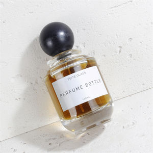 नई डिजाइन लक्जरी राउंड आकार 100 एमएल ग्लास इत्र की बोतल लकड़ी की गेंद कैप के साथ - Product Image 6