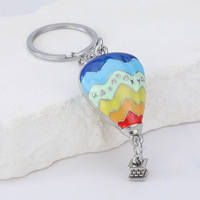 Nouveau style créatif, pendentif rond en alliage de zinc, porte-clés montgolfière, souvenir de sport de plein air, cadeau nuage, vente en gros