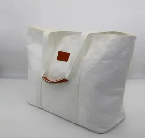耐久性のある環境にやさしい再利用可能なリサイクル洗えるクラフト紙の買い物客カスタム印刷されたロゴが付いた特大のトートバッグ