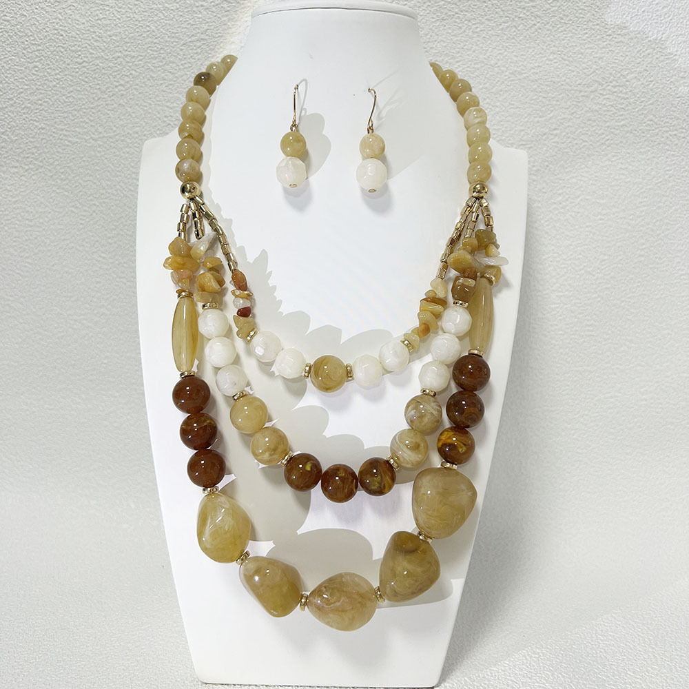 Collana e orecchini a catena in acrilico bicolore beige