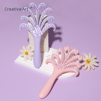 Brosse démêlante en ABS en forme de palmier unique avec picots ronds en nylon pour massage du cuir chevelu, outil de coiffure personnalisé avec logo, vente en gros