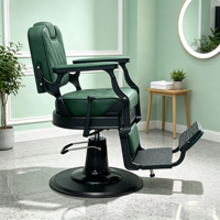 Fauteuil de barbier vintage en cuir matelassé vert foncé, pivotant à 360°, inclinable hydrauliquement, avec repose-pieds