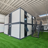 Maison conteneur préfabriquée modulaire en acier de 20 pieds avec mur rideau en verre pour bureau, studio, jardin, extérieur