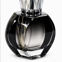Flacon de parfum cylindrique en verre haut de gamme à motif marbre noir et or, texture haut de gamme, sérigraphie, marquage à chaud, finition mate