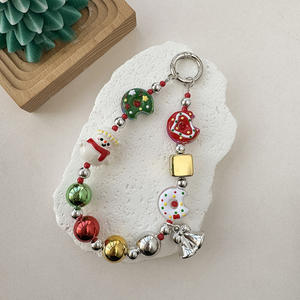 ¡Dios Mío! Esta Cadena para Teléfono con Forma de Donut de Muñeco de Nieve se Está Volviendo Tan Adorable - Product Image 1