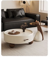 Ensemble de tables basses rondes vintage de luxe, table de salon minimaliste avec espace de rangement, exsudant une sophistication