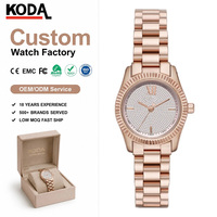 Montre de luxe pour femme en or rose, cadran pavé de cristaux, montre-bracelet tendance en acier inoxydable pour femme, montre habillée à quartz avec lunette cannelée