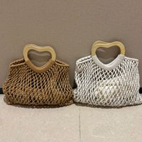 Sac à main vintage en crochet ajouré de luxe pour femme, sac de plage et de shopping en macramé fait main tendance pour l'été avec poignée en bois en forme de cœur