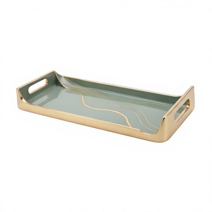 Plateau de service rectangulaire en métal émaillé vert sauge nordique avec accents ondulés dorés et poignées découpées, idéal pour table basse ou ottoman - Product Image 1