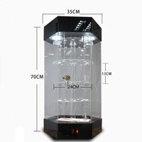 Vente en gros d'usine Vitrine rotative hexagonale en acrylique avec étagères rondes à niveaux, système d'éclairage LED supérieur et porte verrouillable