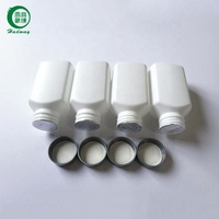 Voedselverpakkingen met inductiefolie verzegeling, kartonnen achterkant en aluminiumfolie voering.